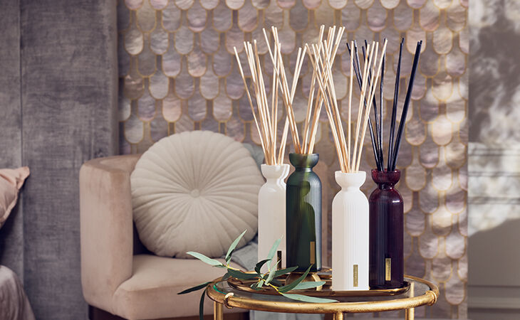 A stylish display of Rituals fragrance sticks in elegant bottles, adding long-lasting scent to a cosy living space.